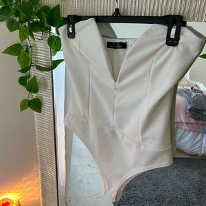 SOLD.  Blue blush deep V bodysuit size large